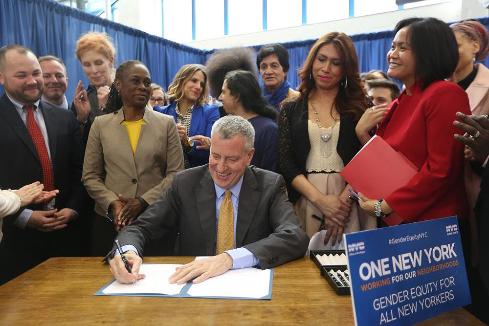Human Rights Commissioner Carmelyn P. Malalis, right, joined Mayor Bill de Blasio during the Exeutivr Order #16 that will make NYC bathrooms safer for transgender people. Photo Credit: Mariela Lombard for NYC Commission of Human Rights.