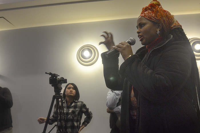 A journalist asking a question of the panel.